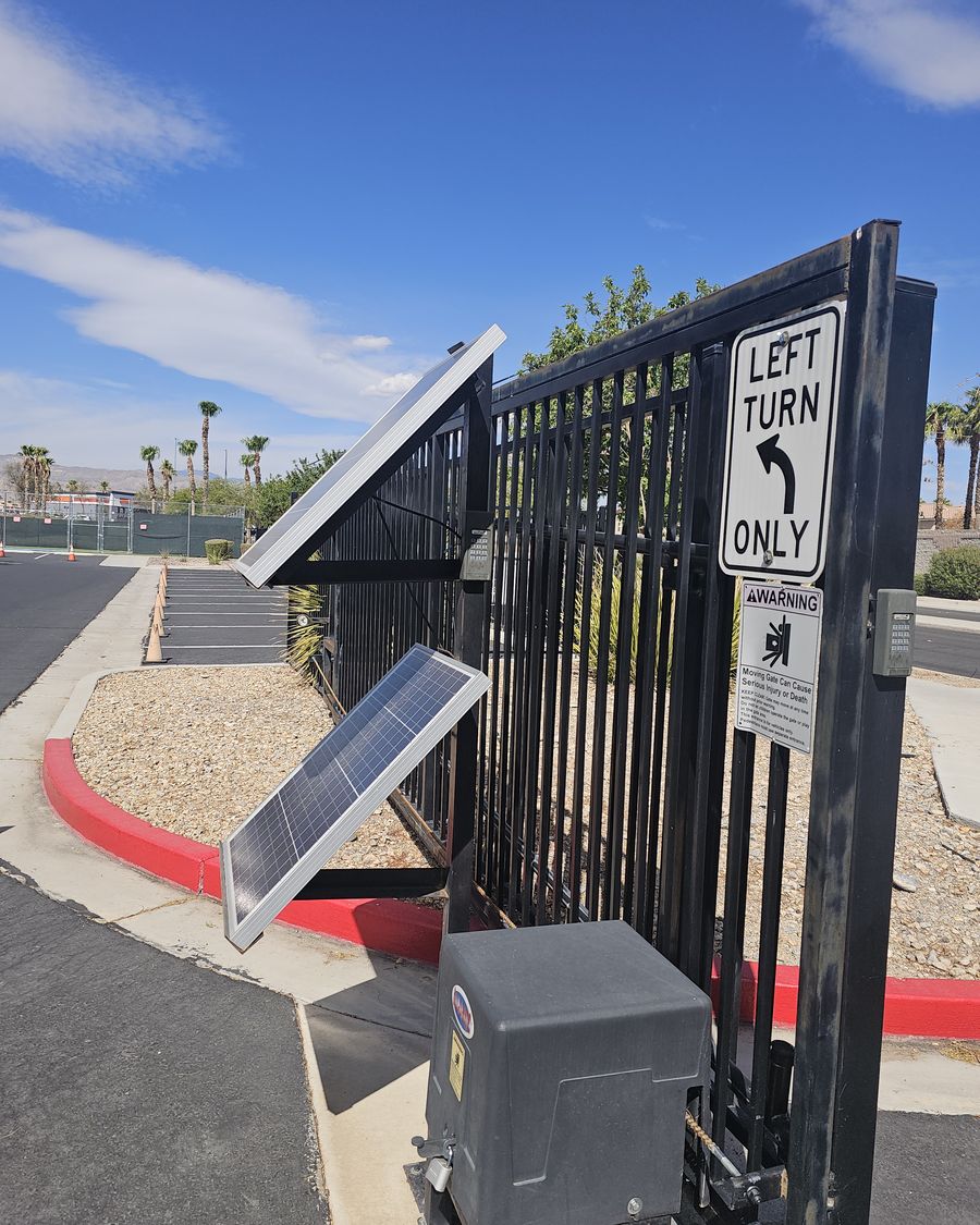 Dual panel solar array feeding a gate motor